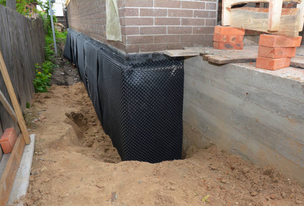 SJ Waterproofing Pros technician performing targeted Waterproofing assessment in Fayetteville, TN